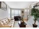 Living room with neutral decor, hardwood floors, and ample natural light at 11419 Romeo Pl, Fishers, IN 46040