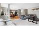 Spacious living room with gray sectional sofa and a fireplace at 11419 Romeo Pl, Fishers, IN 46040
