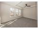 Bright bedroom with gray carpeting and large windows at 18862 Shefler Blvd, Noblesville, IN 46062