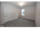 Simple bedroom with grey carpet and window at 18862 Shefler Blvd, Noblesville, IN 46062