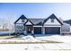 Two-story house with a gray and white exterior, two car garage, and landscaping at 18862 Shefler Blvd, Noblesville, IN 46062