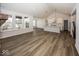 Open concept kitchen with white cabinets, large island, and hardwood floors at 18862 Shefler Blvd, Noblesville, IN 46062
