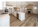 Open concept kitchen with white cabinets, large island, and stainless steel appliances at 18862 Shefler Blvd, Noblesville, IN 46062