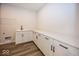 Laundry room with white cabinets and quartz countertop at 18862 Shefler Blvd, Noblesville, IN 46062