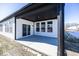 Covered patio with concrete flooring and modern lighting at 18862 Shefler Blvd, Noblesville, IN 46062