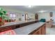 Finished basement with a bar and ample seating areas, perfect for entertaining guests at 691 Walnut Woods Dr, Greenwood, IN 46142
