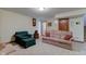 Basement area with green chair, sofas, and classic decor at 691 Walnut Woods Dr, Greenwood, IN 46142
