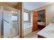 Bright bathroom featuring separate tub and shower, neutral colors, tiled floor, and a window at 691 Walnut Woods Dr, Greenwood, IN 46142