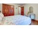 Bedroom featuring hardwood floors, floral bedspread, and a double-door closet at 691 Walnut Woods Dr, Greenwood, IN 46142