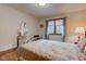 Bedroom with hardwood floors, a floral bedspread, and a dresser at 691 Walnut Woods Dr, Greenwood, IN 46142