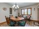 Dining room with wood floors, chandelier, and natural light from window at 691 Walnut Woods Dr, Greenwood, IN 46142