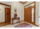 Inviting foyer with tile flooring, paneled front door and elegant wood trim at 691 Walnut Woods Dr, Greenwood, IN 46142