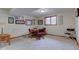 Cozy game room with a round table, seating, and natural light from the window at 691 Walnut Woods Dr, Greenwood, IN 46142