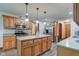 Bright kitchen with island, wood cabinets, stainless appliances and wood flooring at 691 Walnut Woods Dr, Greenwood, IN 46142