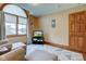 Living room showcases a large arched window, wood floors, a TV, and neutral colors at 691 Walnut Woods Dr, Greenwood, IN 46142