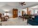 Comfortable living room open to the dining room and entry with carpet and traditional decor at 691 Walnut Woods Dr, Greenwood, IN 46142
