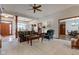 Comfortable living room open to the dining room with carpet and traditional decor at 691 Walnut Woods Dr, Greenwood, IN 46142
