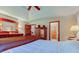 Bright main bedroom featuring hardwood floors, an antique dresser with mirror and access to the ensuite bath at 691 Walnut Woods Dr, Greenwood, IN 46142