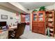 Home office featuring a desk, display cabinet, and inviting chair, ideal for working at home at 691 Walnut Woods Dr, Greenwood, IN 46142