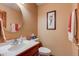 This half-bathroom offers a single sink vanity and neutral decor at 691 Walnut Woods Dr, Greenwood, IN 46142