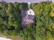 Aerial view of the property showing the home's layout and surrounding wooded area at 9943 Irishman'S Run Ln, Zionsville, IN 46077