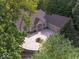 Aerial of property featuring circular drive, lush greenery and exterior of the home at 9943 Irishman'S Run Ln, Zionsville, IN 46077