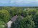 Aerial shot showcasing the home's setting with green landscape and distant fields at 9943 Irishman'S Run Ln, Zionsville, IN 46077