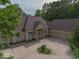 Aerial view showcasing brick house with large driveway and well maintained grounds at 9943 Irishman'S Run Ln, Zionsville, IN 46077