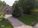 Picture of a home with a large driveway, mature trees, and well-maintained lawn at 9943 Irishman'S Run Ln, Zionsville, IN 46077