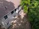 Aerial shot of the back of the home showing the gravel area and upstairs deck at 9943 Irishman'S Run Ln, Zionsville, IN 46077