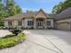 Lovely brick home boasts large front yard, driveway, and manicured landscaping at 9943 Irishman'S Run Ln, Zionsville, IN 46077