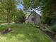 Picture of a single Gathering home with mature trees surrounding the property and lush landscaping at 9943 Irishman'S Run Ln, Zionsville, IN 46077