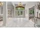 Grand foyer with tile flooring, chandelier, and views to the dining area at 9943 Irishman'S Run Ln, Zionsville, IN 46077