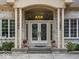 Elegant front entry with chandelier, sidelights, and decorative planters at 9943 Irishman'S Run Ln, Zionsville, IN 46077