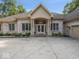 Charming single story home with light brick and large windows and a large front yard at 9943 Irishman'S Run Ln, Zionsville, IN 46077
