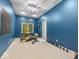 Home gym featuring exercise equipment, a ceiling fan, and natural light at 9943 Irishman'S Run Ln, Zionsville, IN 46077