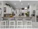 Modern kitchen featuring white cabinets, granite countertops, and breakfast bar at 9943 Irishman'S Run Ln, Zionsville, IN 46077