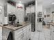 A kitchen with a central island featuring a sink, stainless steel refrigerator, and a 'pantry' sign at 9943 Irishman'S Run Ln, Zionsville, IN 46077