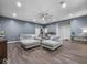 Inviting living room featuring a large sofa, hardwood floors, and ample natural light at 9943 Irishman'S Run Ln, Zionsville, IN 46077