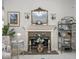 Charming fireplace with decorative mirror and shelving in the living room at 9943 Irishman'S Run Ln, Zionsville, IN 46077