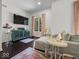 A sunlit living room features a plush sofa, a blue cabinet, and a large window at 9943 Irishman'S Run Ln, Zionsville, IN 46077