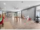 Spacious living room with gray walls, hardwood floors, and filled with natural light at 9943 Irishman'S Run Ln, Zionsville, IN 46077