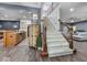 Spacious staircase leading to the upper level with rod iron details and wood flooring at 9943 Irishman'S Run Ln, Zionsville, IN 46077