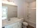Bathroom featuring white vanity, toilet, and shower-tub combo at 4982 Reavie Ct, Noblesville, IN 46062