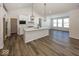 Modern kitchen with white cabinets, quartz countertops and stainless steel appliances at 4982 Reavie Ct, Noblesville, IN 46062