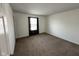 Carpeted bedroom featuring neutral walls and a large window, creating a bright and airy space at 1946 Central Park W Blvd, Greenwood, IN 46143