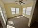 Sunlit room with neutral carpet, vaulted ceiling, and access to the outdoors at 1946 Central Park W Blvd, Greenwood, IN 46143