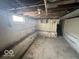 Unfinished basement with concrete floor and exposed wiring at 234 Ringwood Way, Anderson, IN 46013