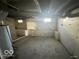 Unfinished basement with concrete walls and ceiling with exposed pipes at 234 Ringwood Way, Anderson, IN 46013