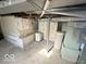 Unfinished basement with concrete floor and visible utilities at 234 Ringwood Way, Anderson, IN 46013